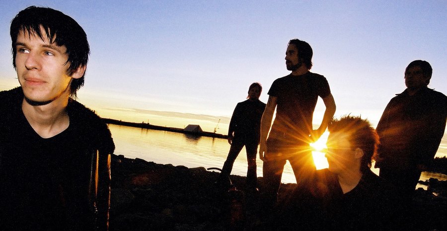 The Drowners at dusk against the sun